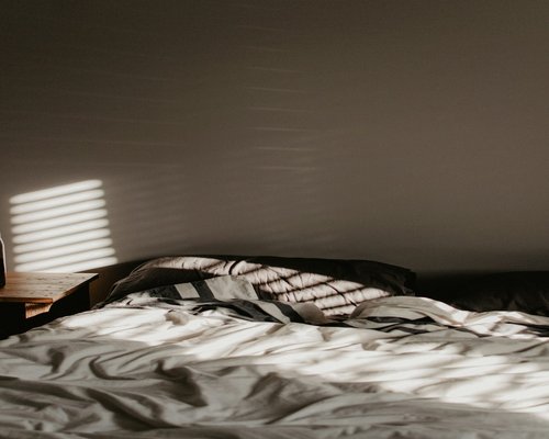 A cozy bedroom setting emphasizing a peaceful sleep routine