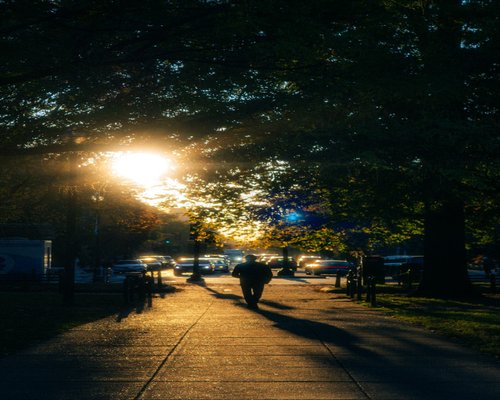 A person taking a light walk through an urban park